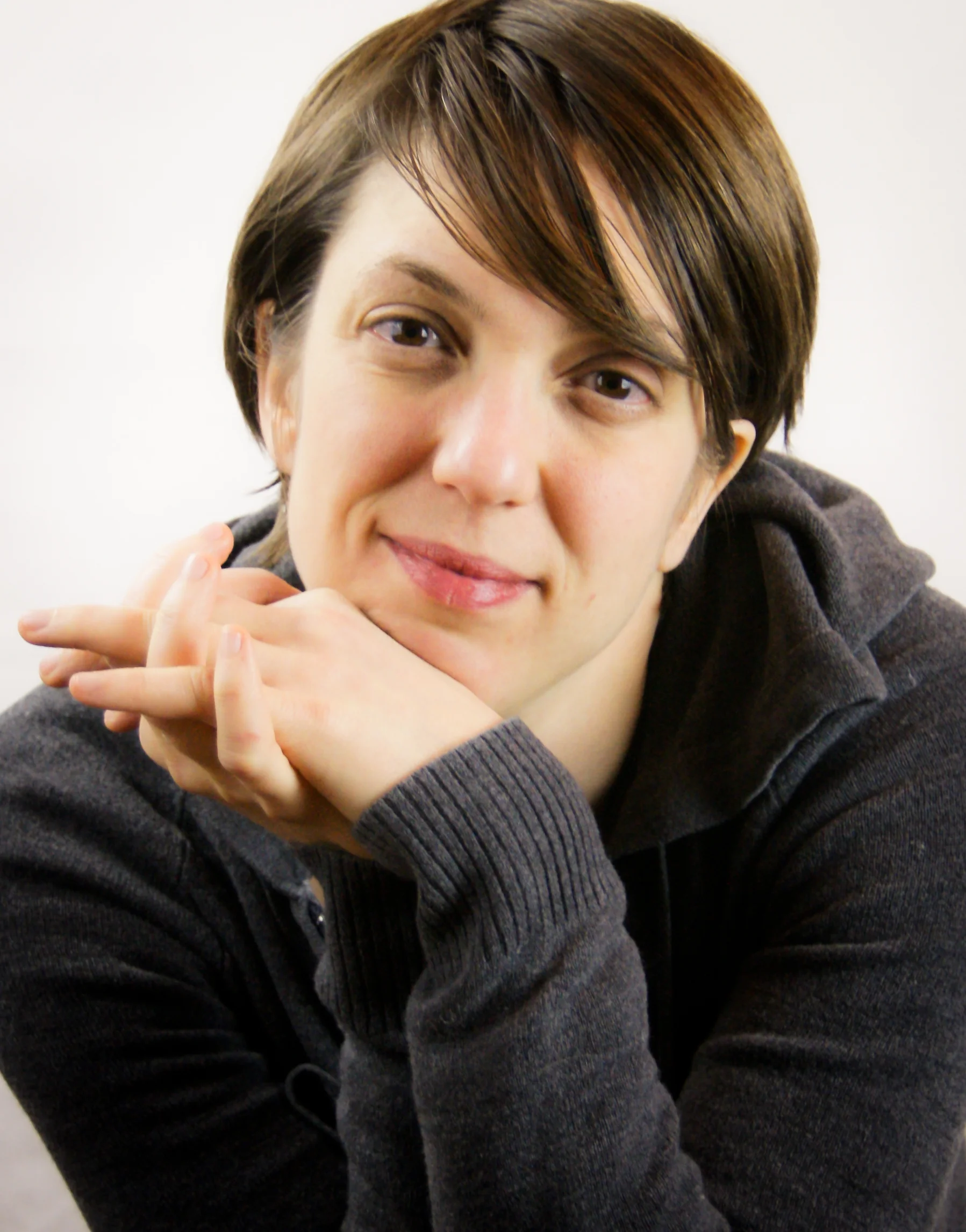 headshot folded hands.jpg