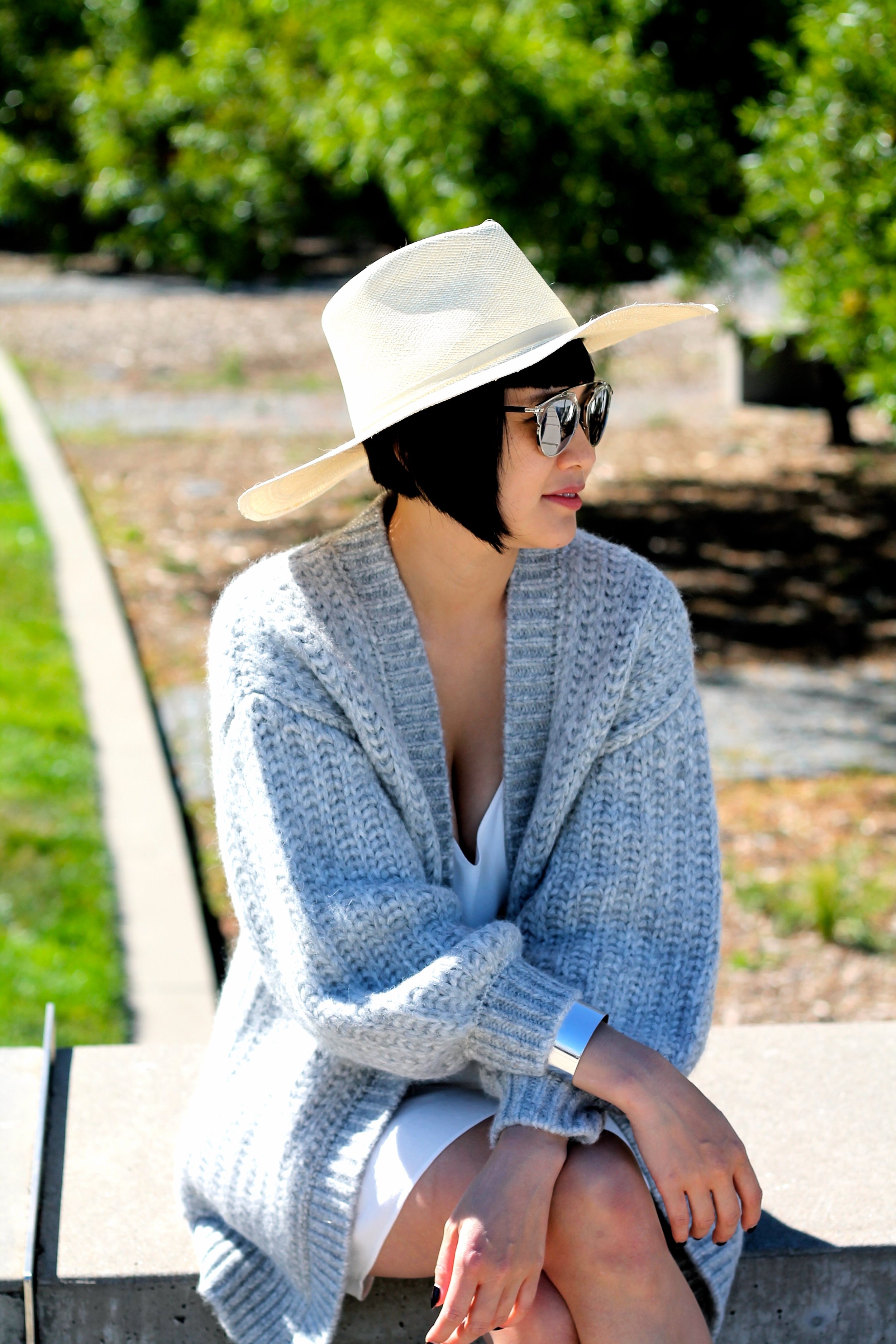 Cuyana sweater and hat , Svelte Metals cuffs, Dior sunglasses