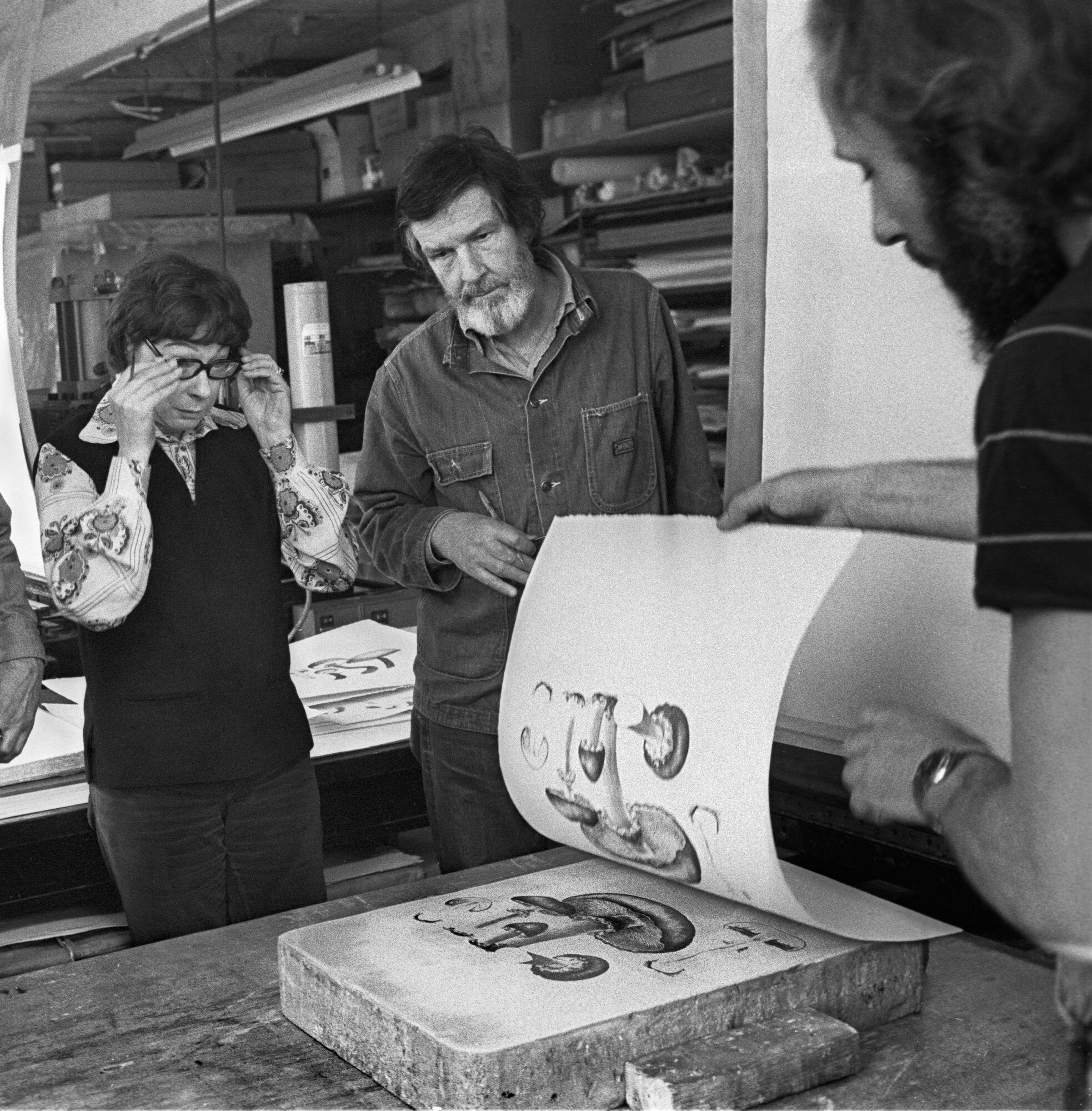 Cage and Lois Long oversee printing of Mushroom Book at Hollander Workshop, NY, 1972. Photograph by James Klosty.