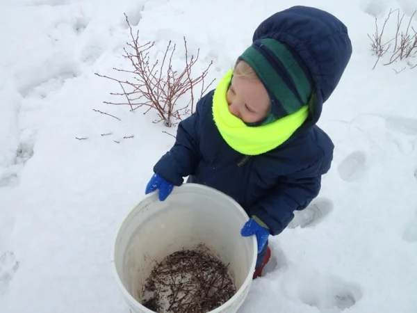 Benny holding the pruning bucket.