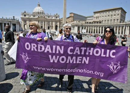 Representatives of the Women's Ordination Conference stage a protest in front of St. Peter's Basilica in Rome on Tuesday, June 8, 2010. AP PHOTO/PIER PAOLO CITO