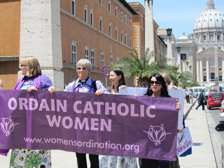 Representatives of the international umbrella network Women's Ordination Worldwide protest in front of St. Peter's Basilica at the Vatican. Erin Saiz Hanna, Executive Director of the US based Women's Ordination Conference said the Vatican has turned a blind eye to male priests who "destroy the lives of children and families, but jumps at the chance to excommunicate women."