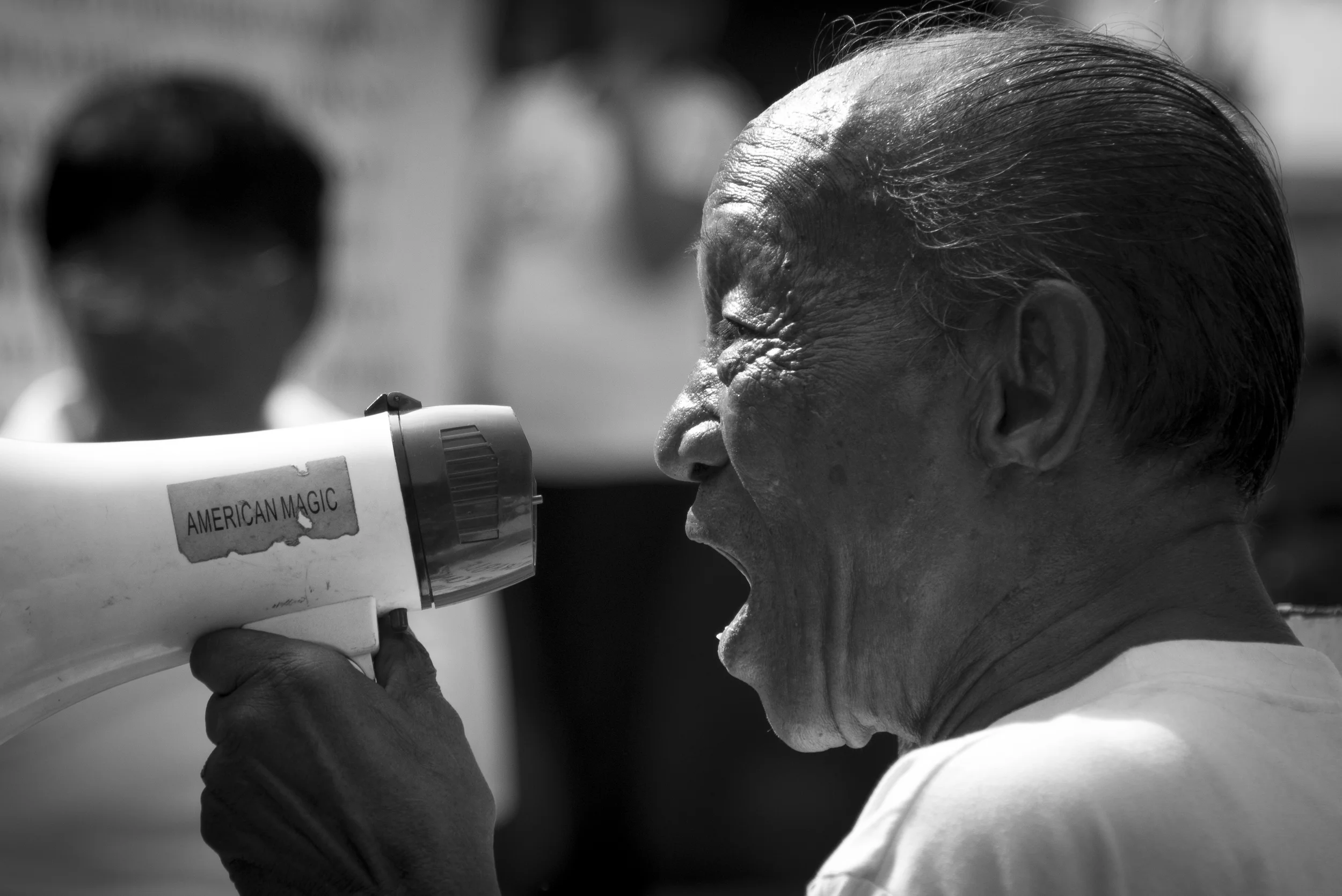 On October 4th, Ayala Avenue was closed to traffic to allow the public to protest and criticise the government's "Pork Barrel" Fund. Photojournalism is my first love, and to see this man speak while his grandchild stood by his side was overwhelming. 