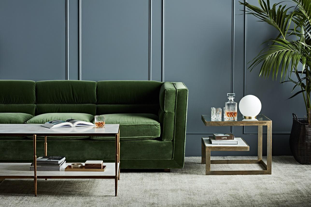 The Bogart Block sofa in lush forest green velvet available to purchase via Bibby + Brady