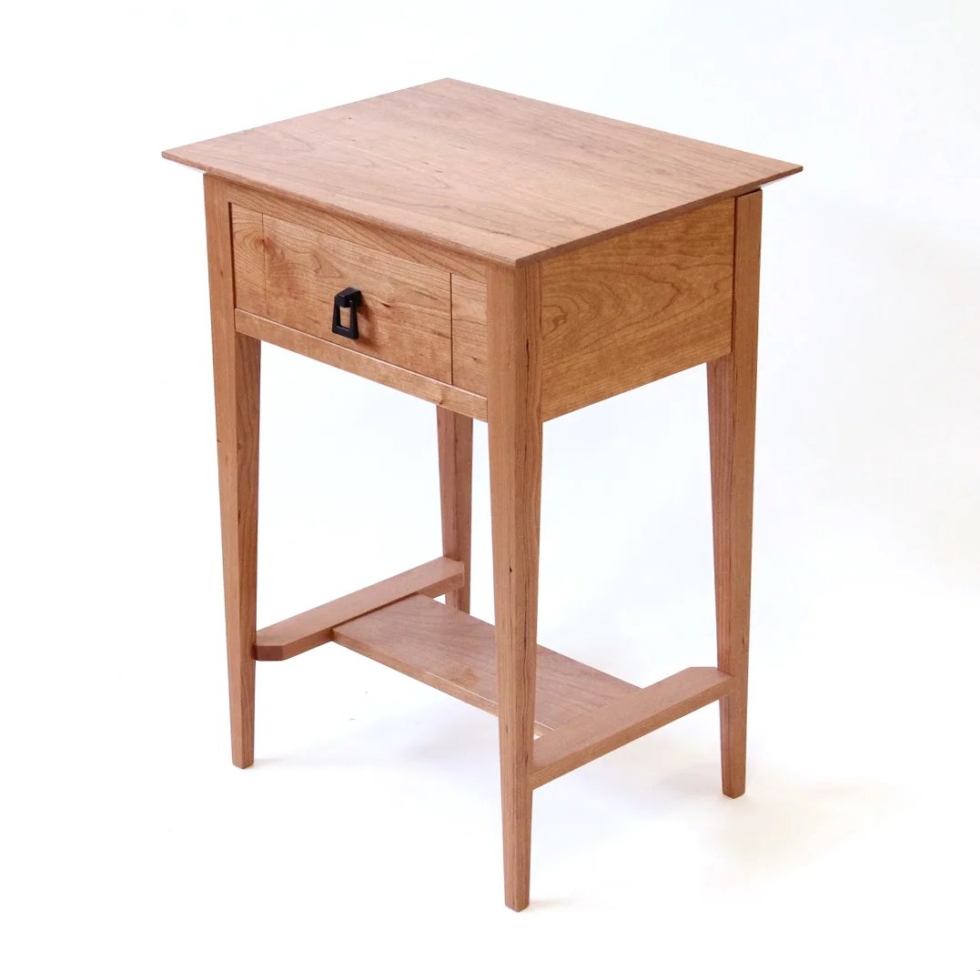 Handcrafted wooden nightstand with hidden drawer compartment