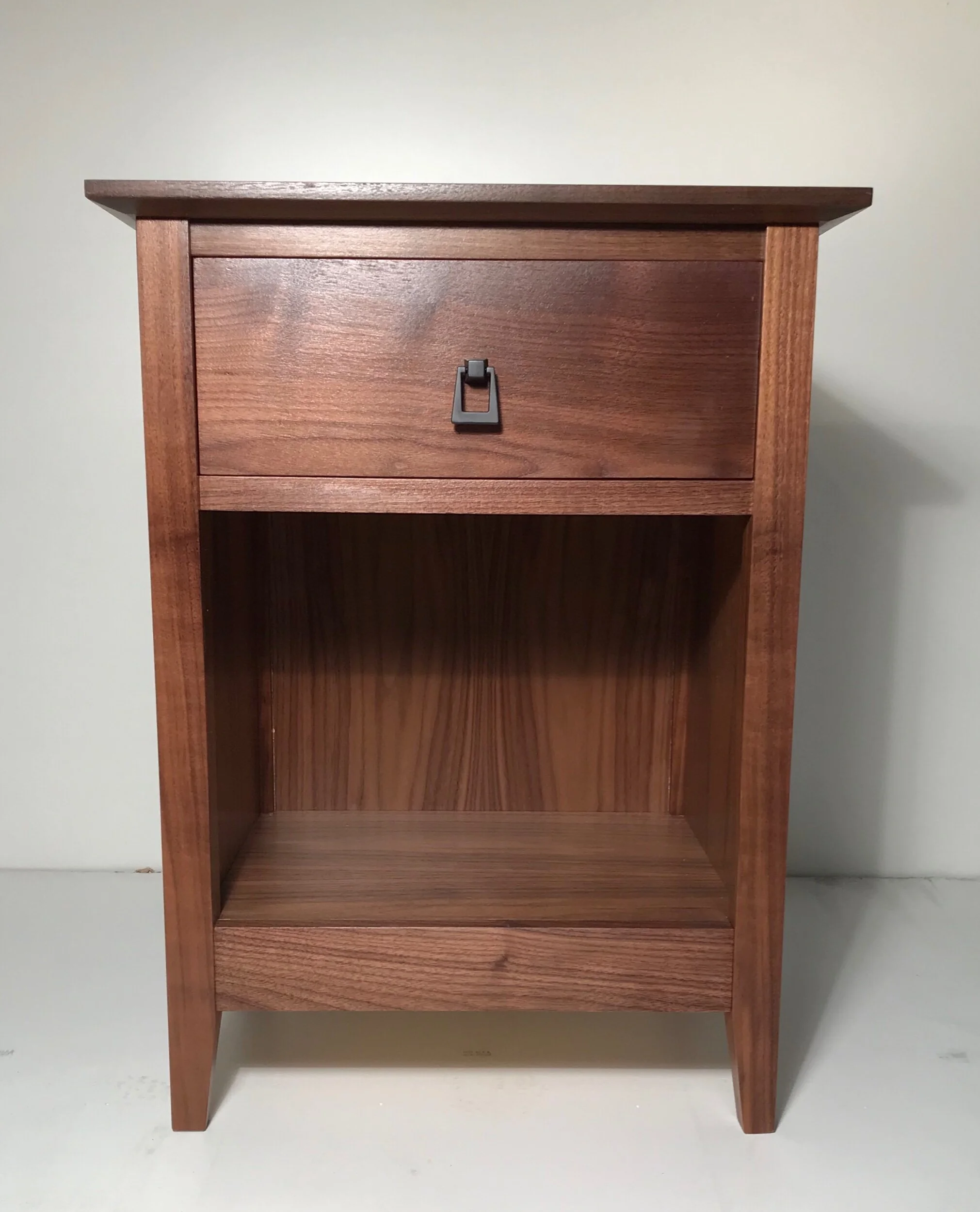 Hidden storage nightstand in walnut wood with secure compartment disguised as a standard drawer.