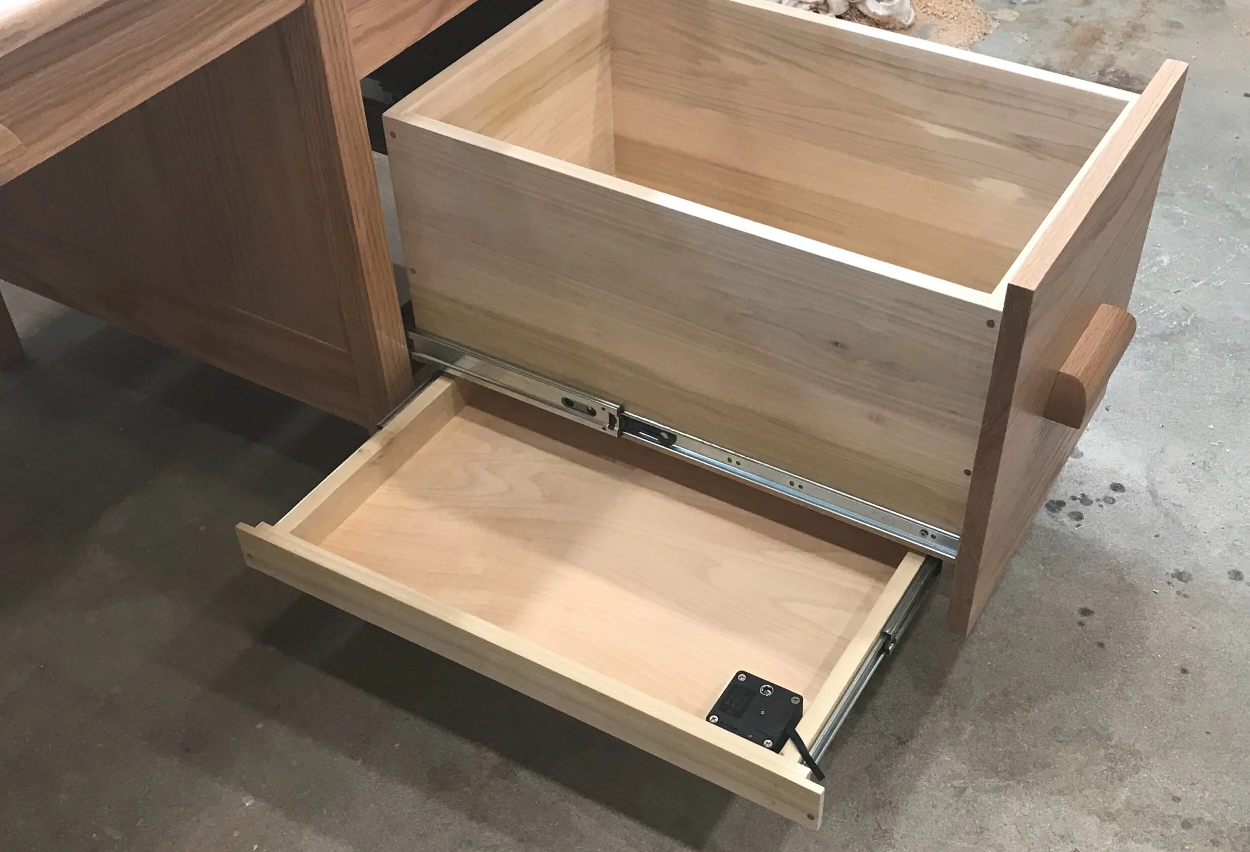 Close-up of hidden compartment in QLIne Tactical Desk