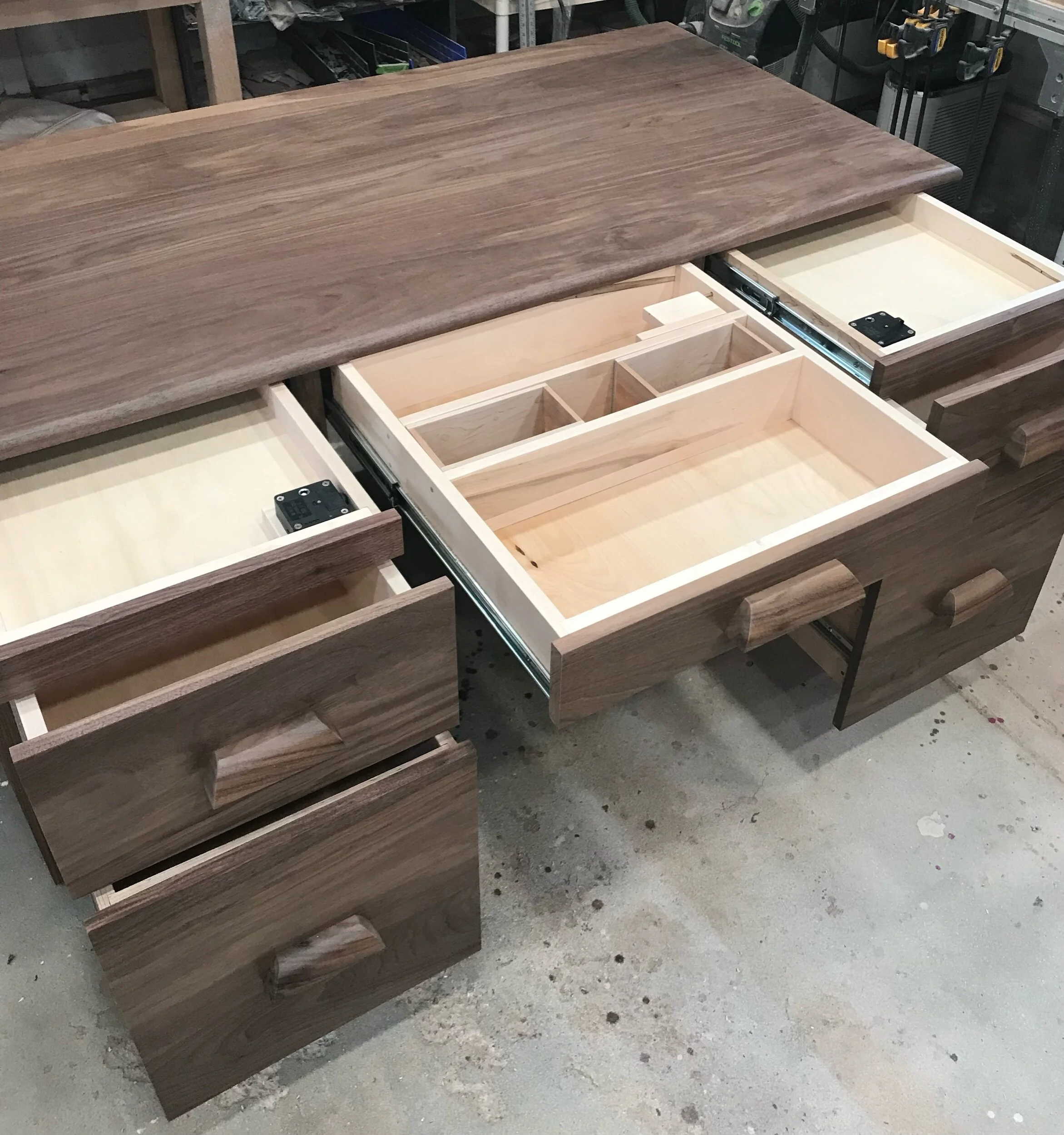 Side angle of handcrafted concealment desk in walnut finish