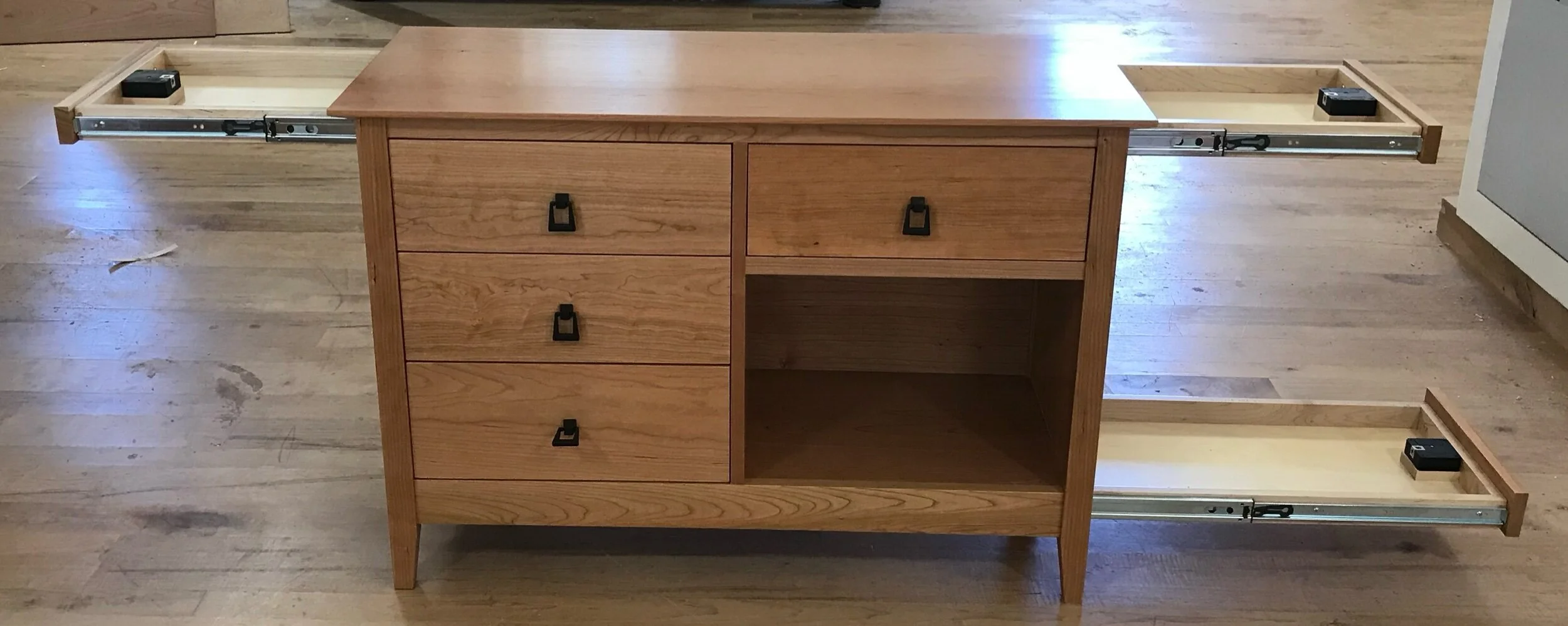 Handcrafted concealment nightstands in walnut and cherry wood with secure hidden storage drawers.