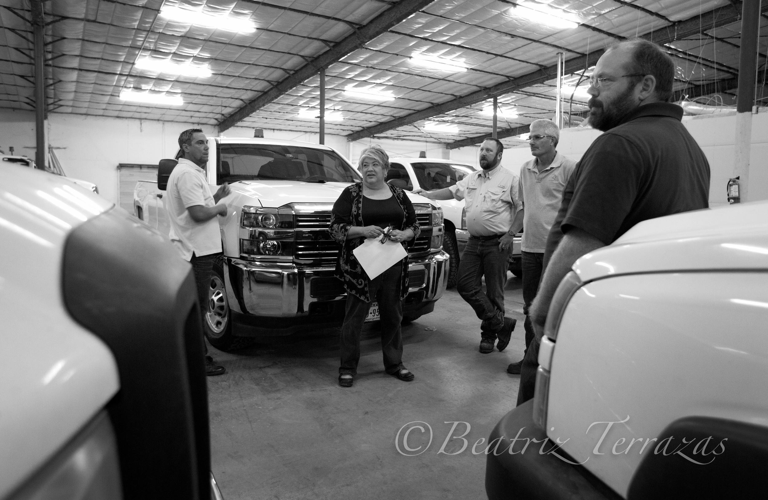 Rosa in The Rios Group shop discussing the fleet with her team.