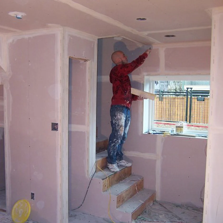 Mudding the joints at the 11th and Carnarvon lane house.