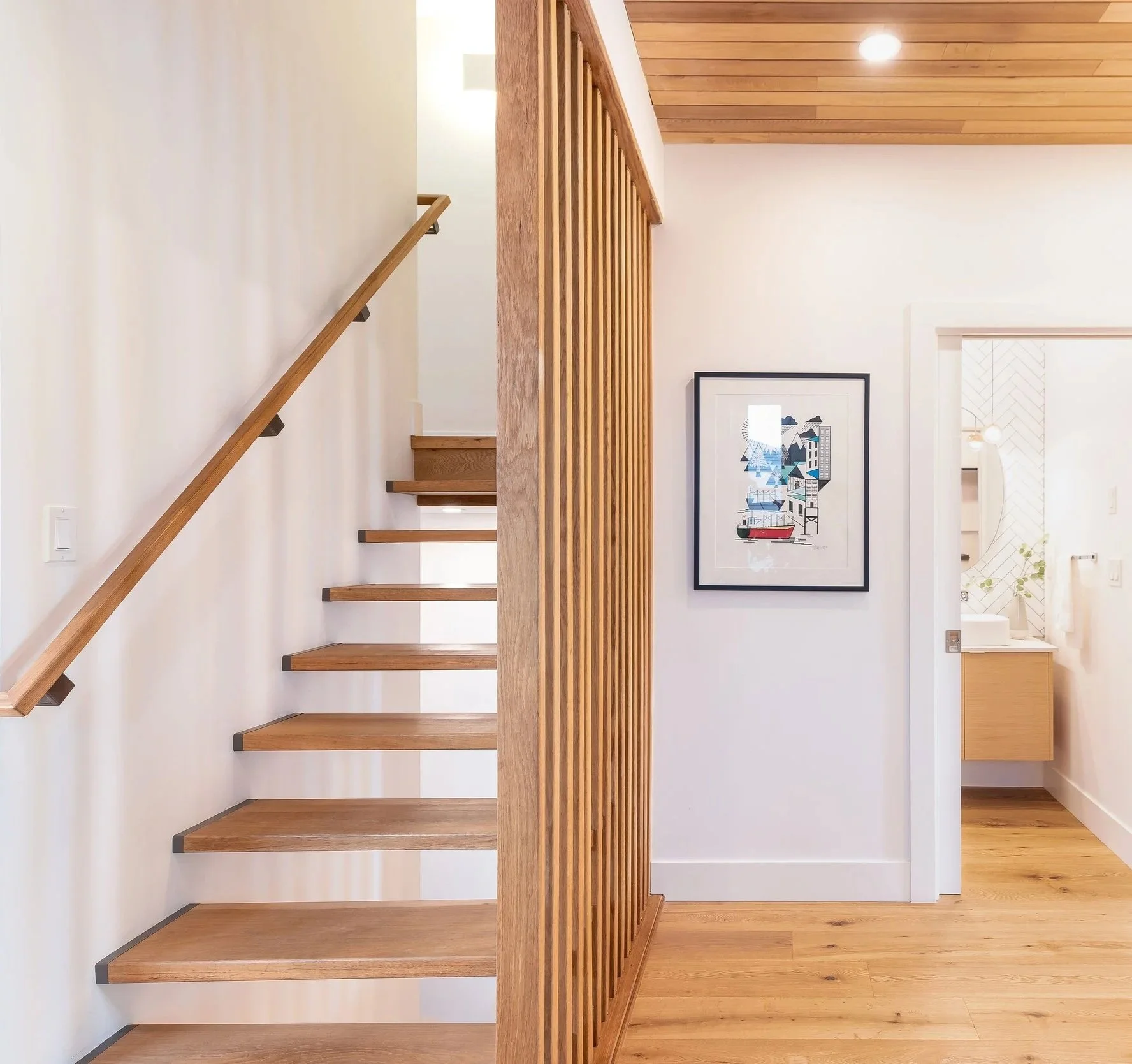 Wooden stair and entry in the E.37th passive house designed and built by Lanefab.