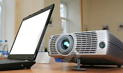laptop-with-computer-projector-on-table-thumb5606682.jpg