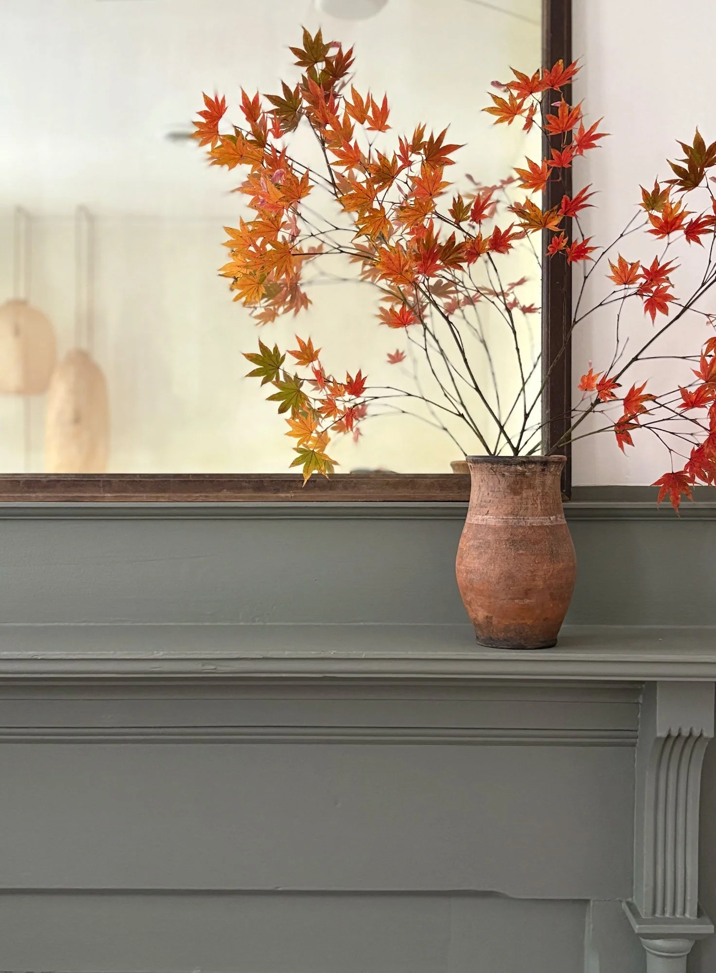 historic townhouse in Richmond Virginia with antique vase and muted green paint