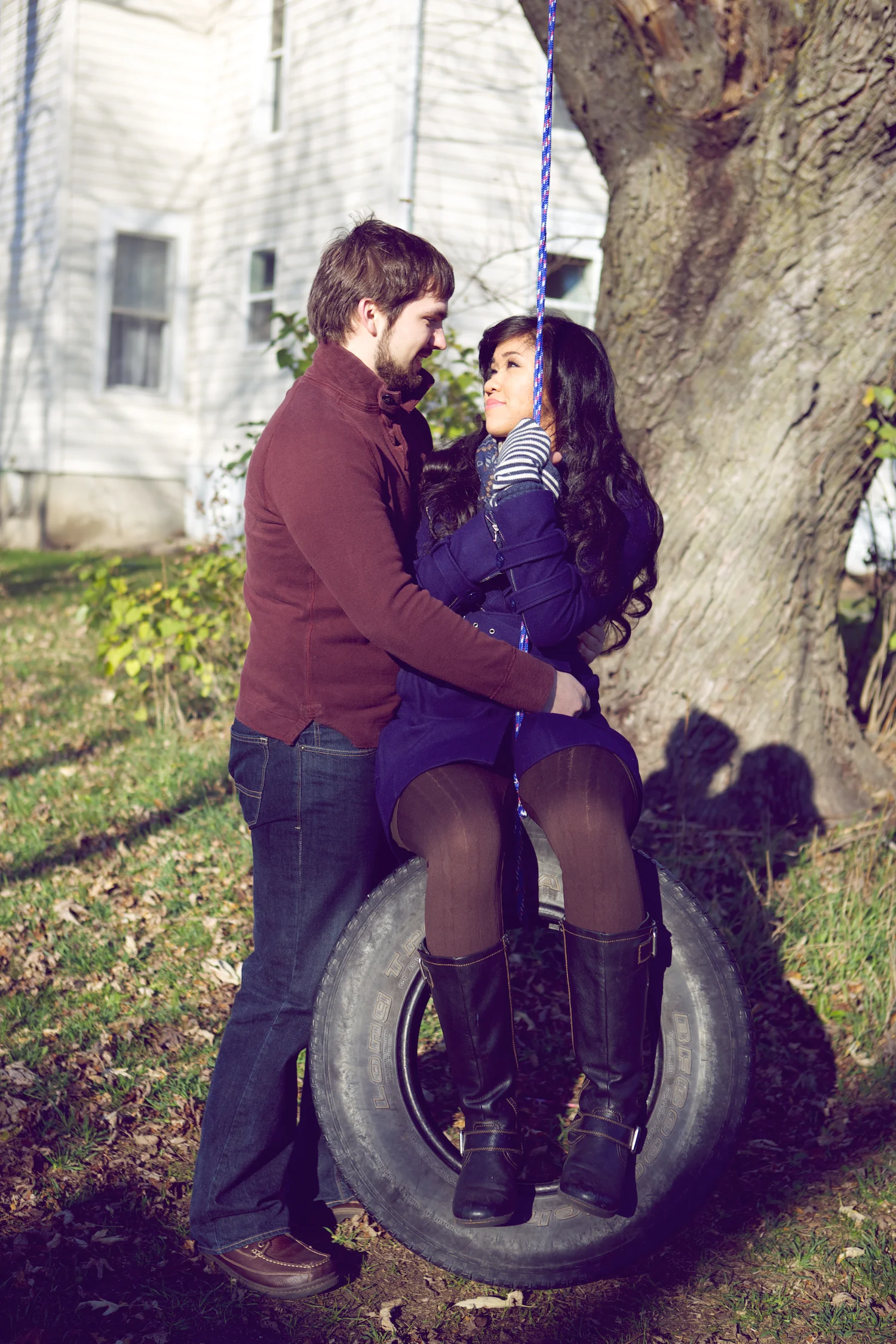 tire swing, Winterset, Iowa, farm, bridge, hedge maze, chess, chess set, adventure, props, castle, playing chess, engagement session