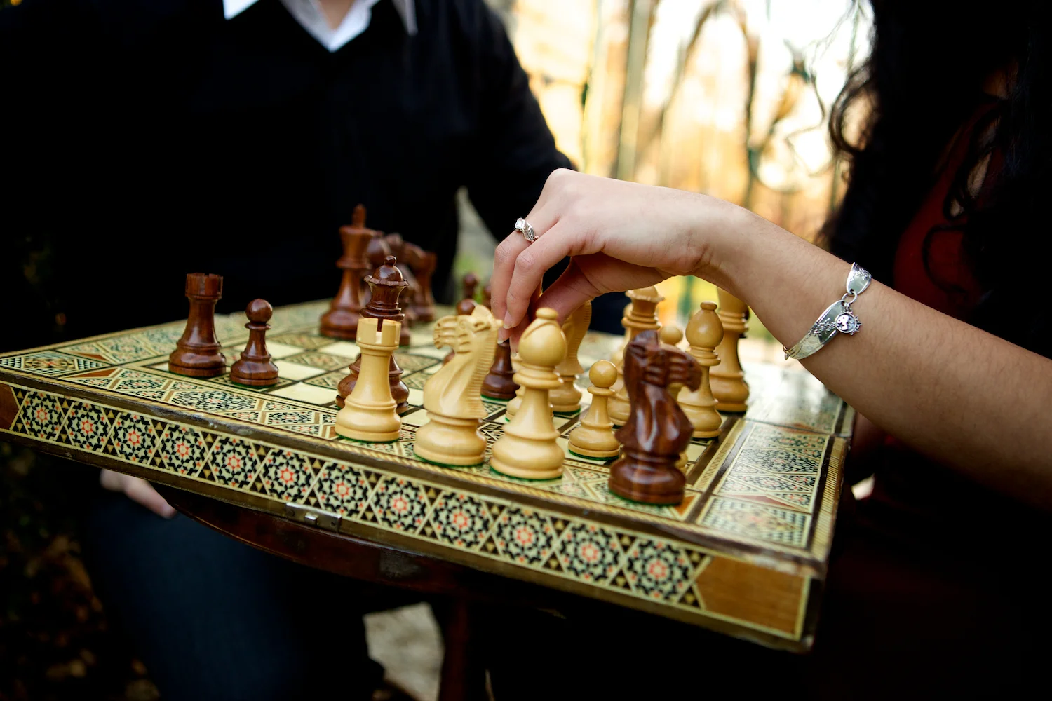 t ire swing, Winterset, Iowa, farm, bridge, hedge maze, chess, chess set, adventure, props, castle, playing chess, engagement session