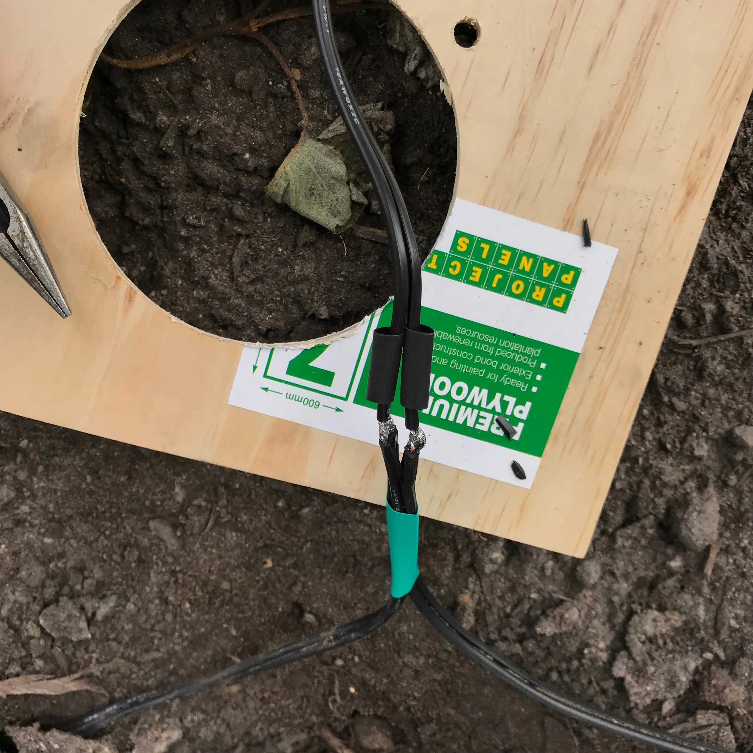 The adjoining wire soldered on to the ends of the stripped wire. Don't forget the smaller in diameter heatshrink tubing for the 2 soldered joins!