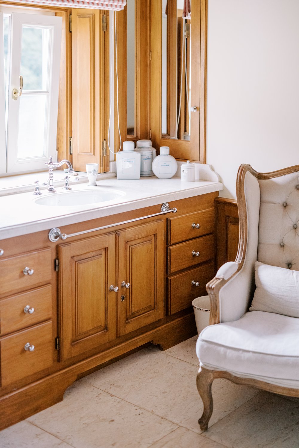 Bathroom with antique furniture prepared for the bride at Quinta da Bela Vista