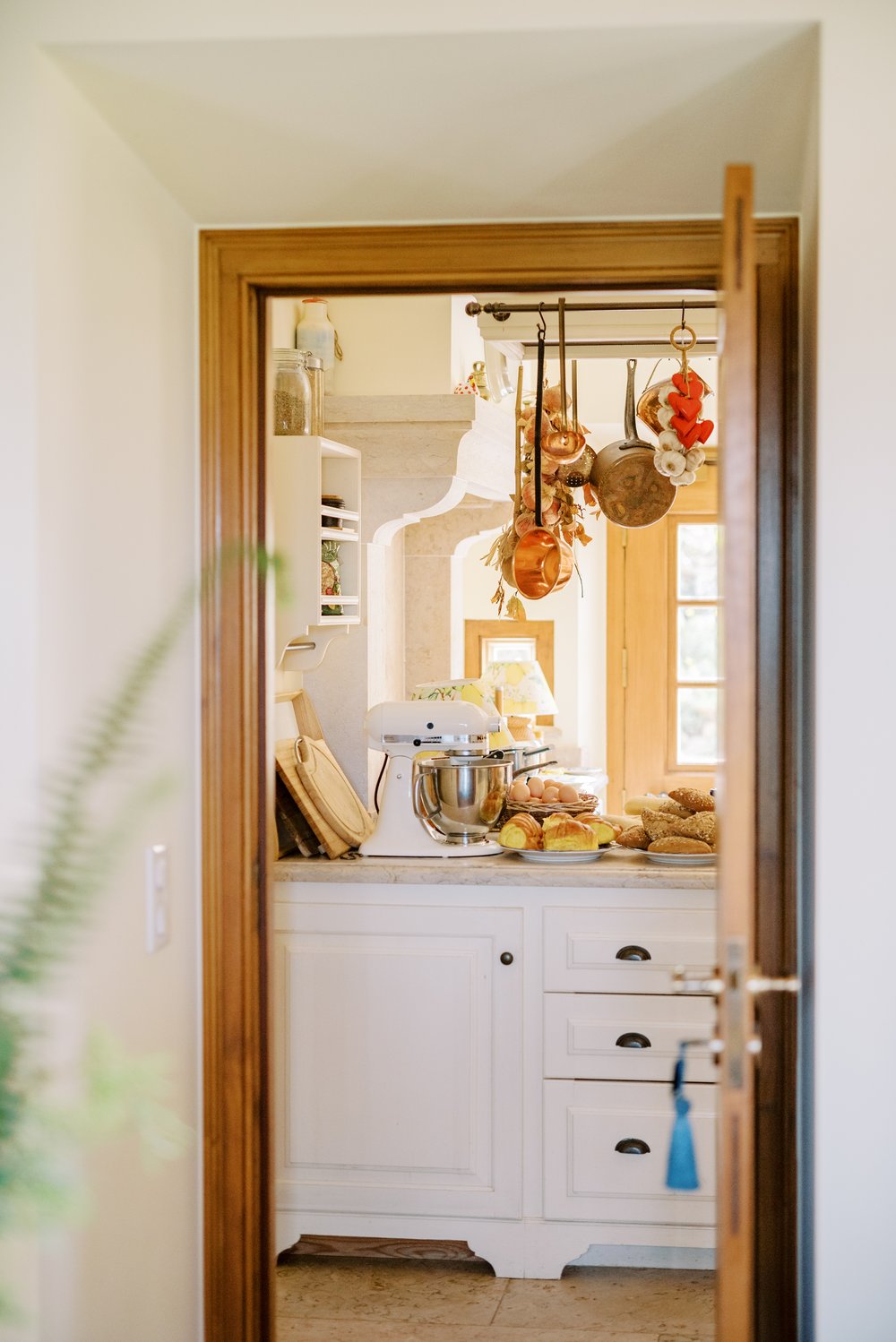 A kitchen captured from the doorway with a rustic style, prepared for the wedding couple and guests