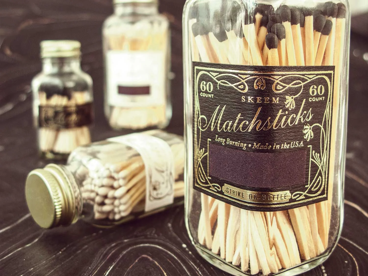 matchstick.bottles.white.black.gold.jpg