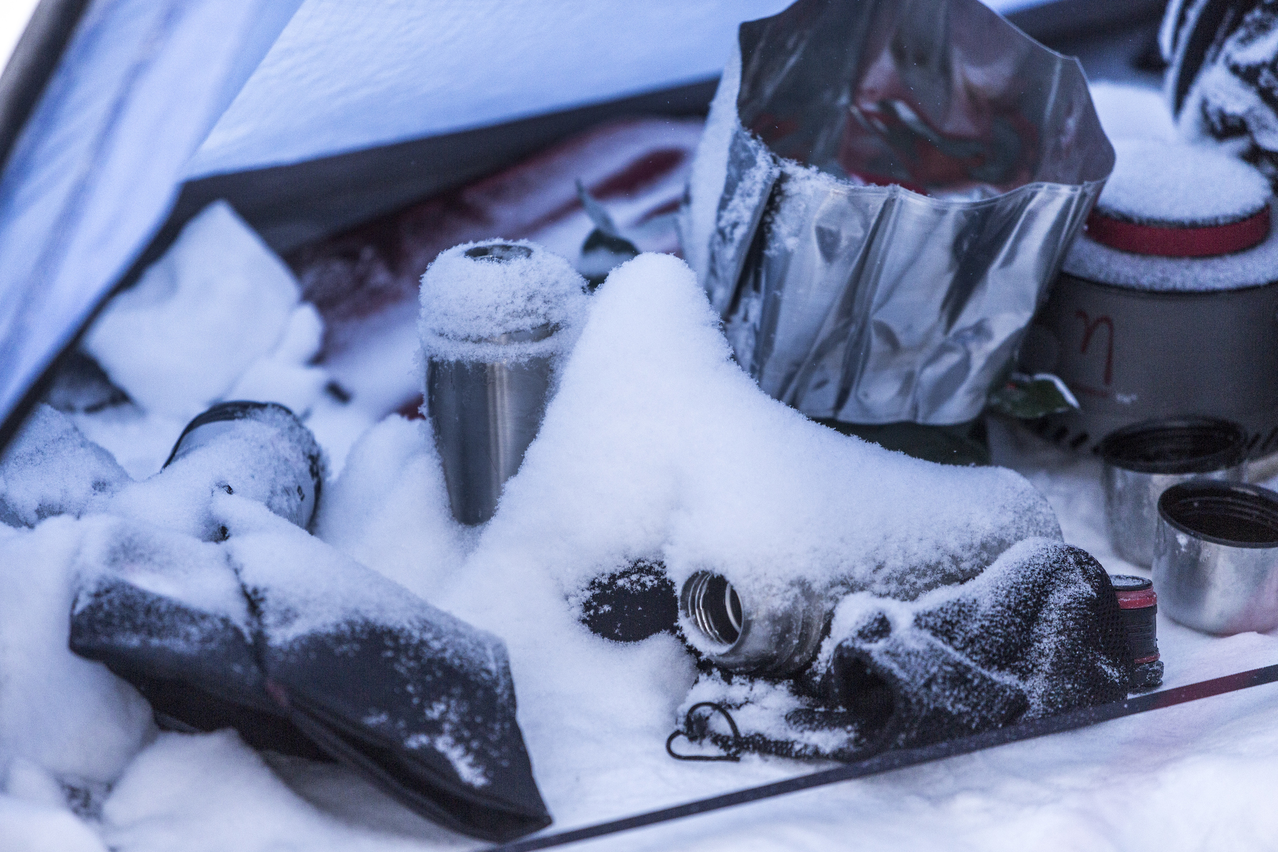 On Fjällräven Polar, our kitchen supplies are limited to a small petrol-fueled camp burner, a thermos, a drinking bottle, a cooking pot and utensils. Minimalist philosophy at work. (Photo by Håkan Wike for Fjällräven International. All rights reserved.)