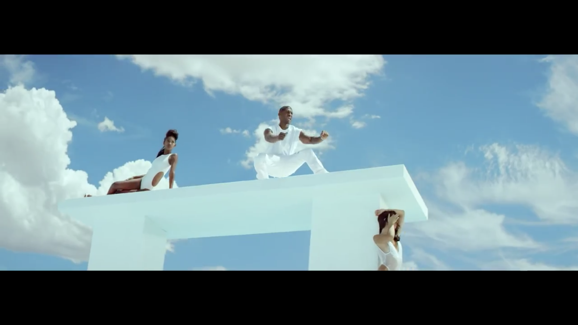 usher surrounded by girls in new flame.jpg