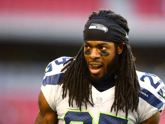 richard sherman looking hot on the field with his tongue poking out omg I can't handle this.jpg