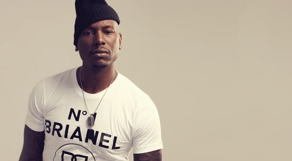 tyrese looking hot with a slim fit shirt and a knit cap.jpg