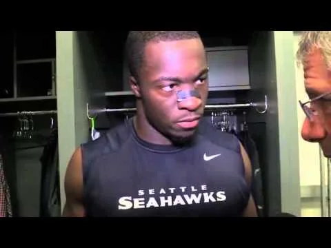 Kevin Pierre-Louis looking hot and giving a hot look to a white guy.jpg