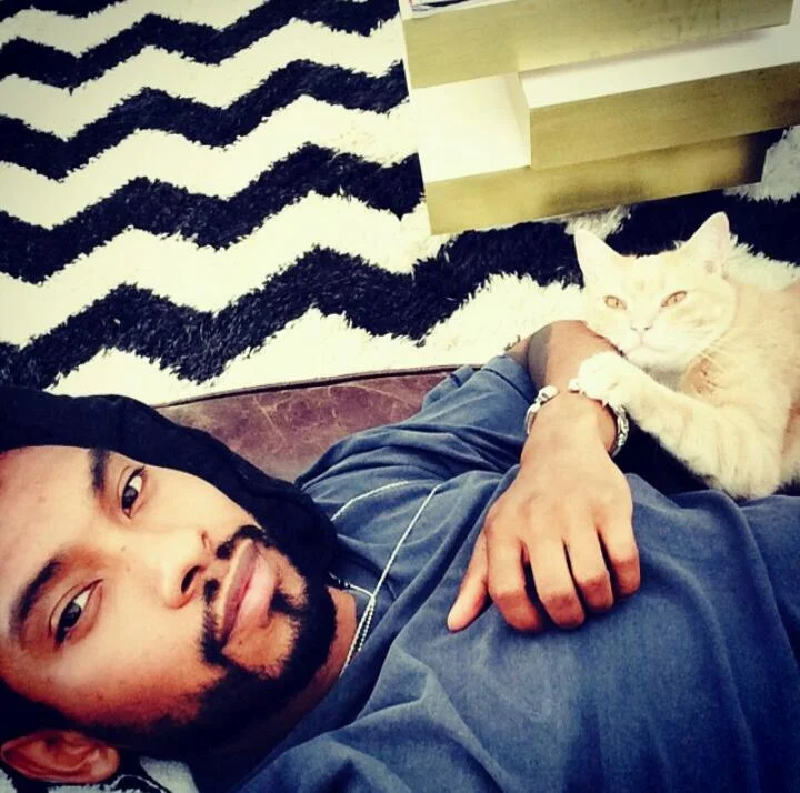 Miguel relaxing and looking hot with his cat.jpg