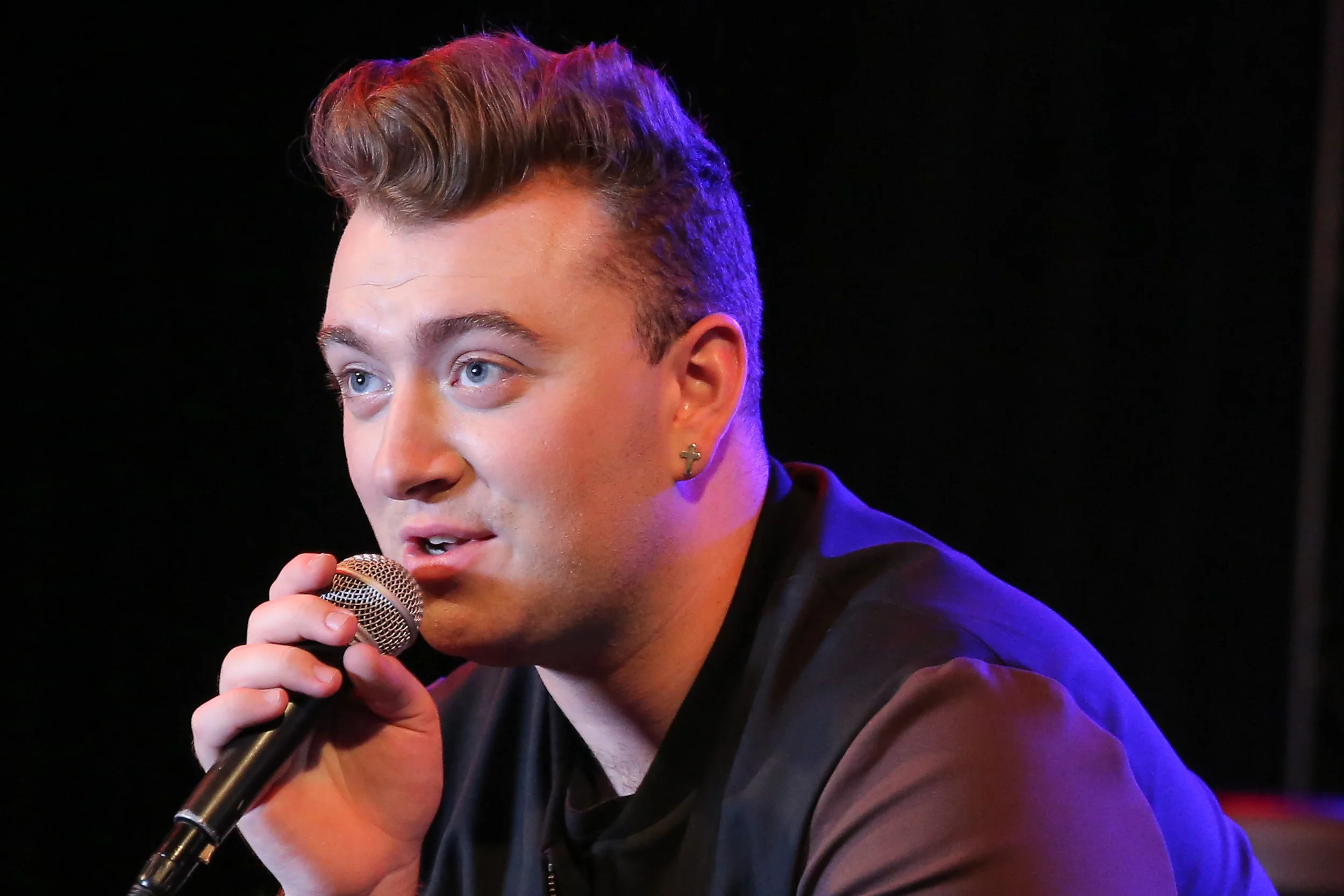 Sam Smith bellowing gibberish into the microphone.jpg