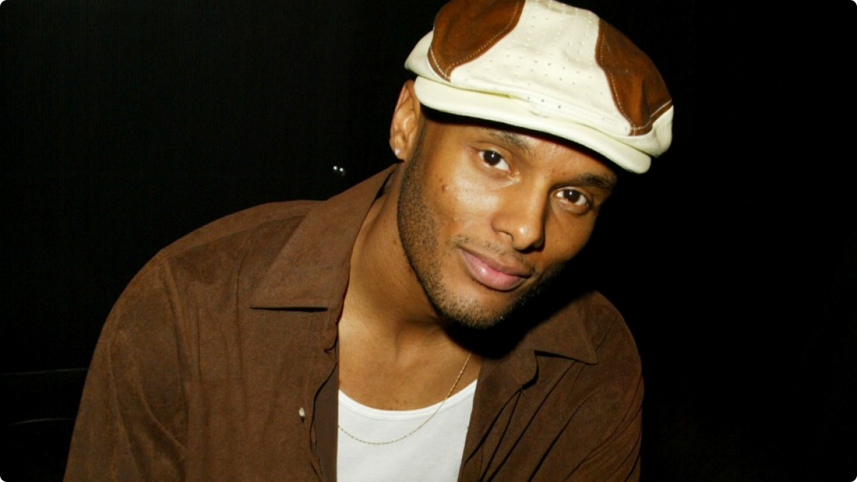 Kenny Lattimore looking hot in the dark with a hat on.jpg