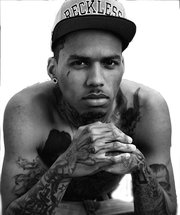 Kid Ink looking hot and serious in a greyscale pic with no shirt on and only wearing a hat.jpg