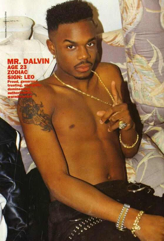 Mr Dalvin posing on the bed without a shirt on omg.jpg