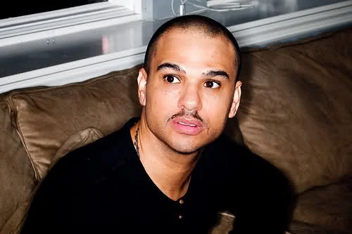 Chico DeBarge sitting on a couch looking really hot omg.jpg