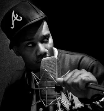 Michael Keith looking hot with the microphone near his mouth.jpg