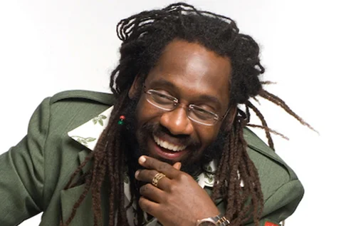 Tarrus Riley looking hot smiling with a bead in his hair.jpg