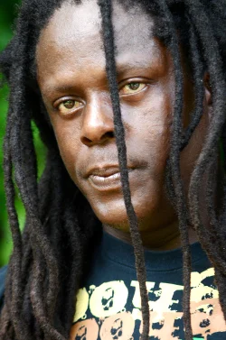 Richie Spice looking hot with his dreadlocks covering his face.jpg
