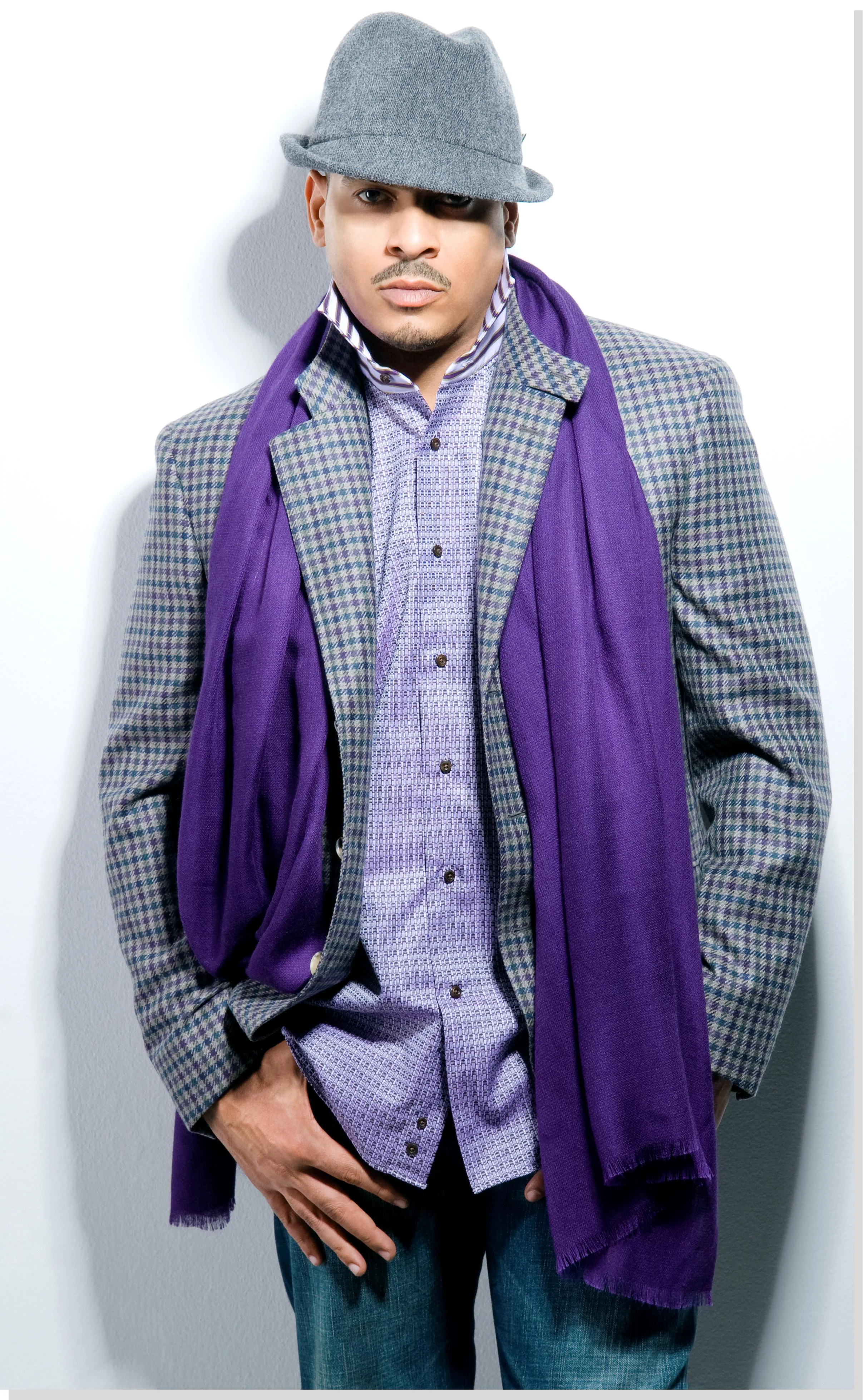 Christopher Williams wearing a casual suit and wearing purple.jpg