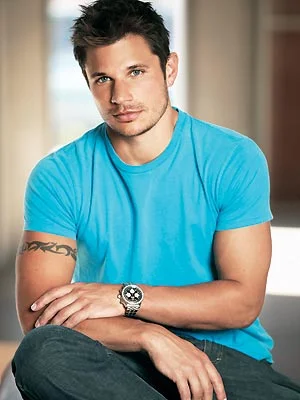 Nick Lachey wearing a turquoise shirt and looking hot.jpg