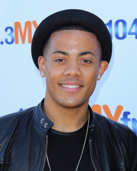 Nico Sereba looking right at the camera smiling.jpg