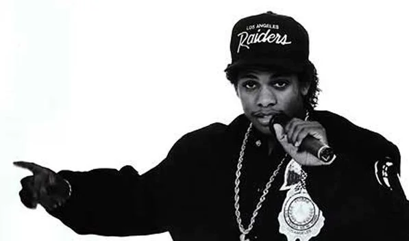 Eazy E looking hot in a greyscale photo of him with the microphone.jpg