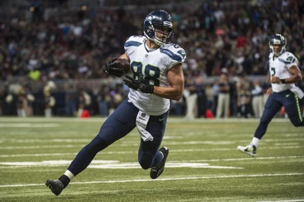 Jimmy Graham looking hot with the football during his first Seahawks game.jpg