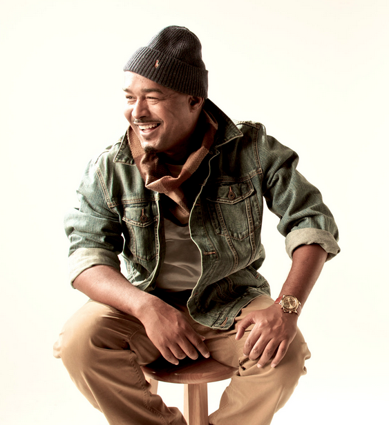 Skillz sitting down on a stool and looking hot.jpg