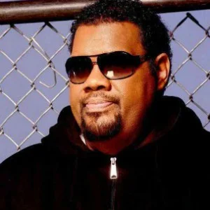 Fatman Scoop looking hot behind a chainlink fence.jpg