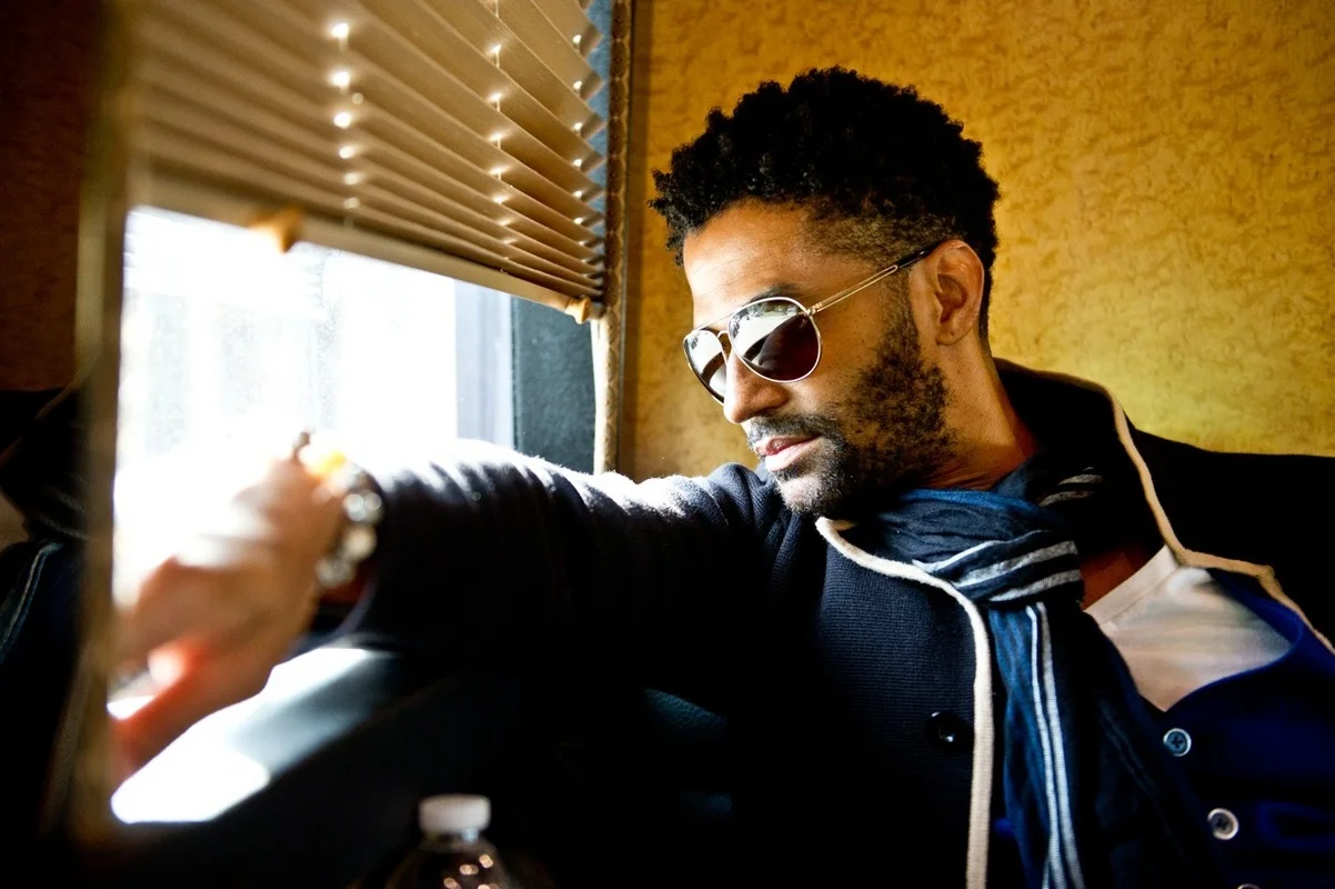 Eric Benét looking hot af in sunglasses and a coat.jpg