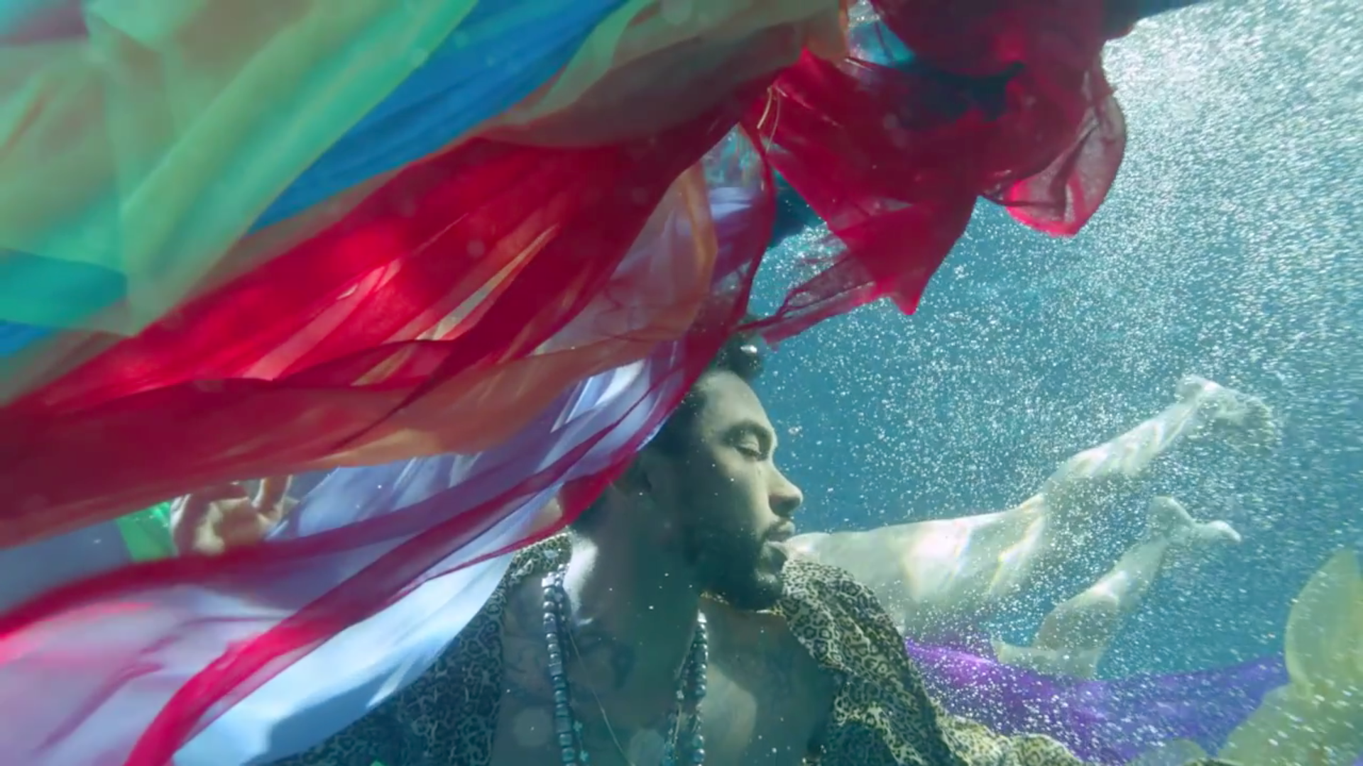 Miguel submerged in a body of water looking hot af in the Waves video teaser.jpg