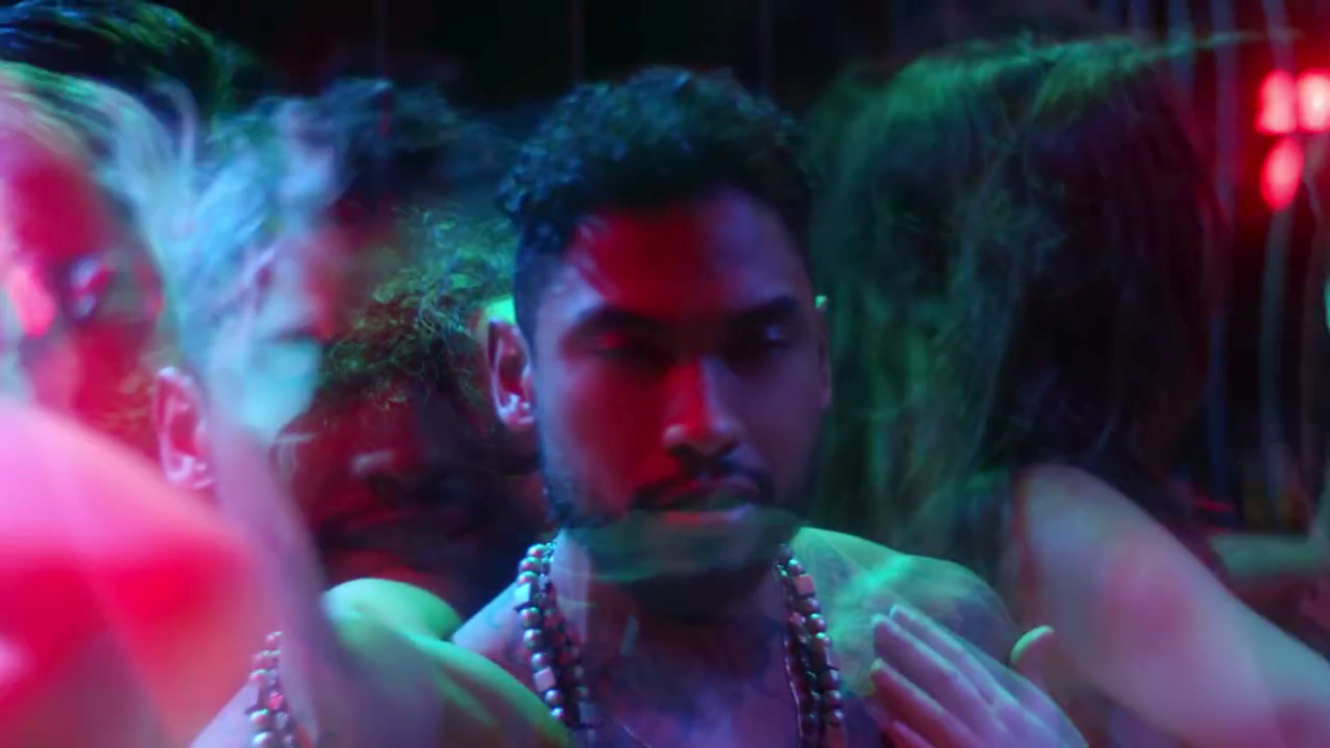 Miguel being passed around in the Waves video.jpg