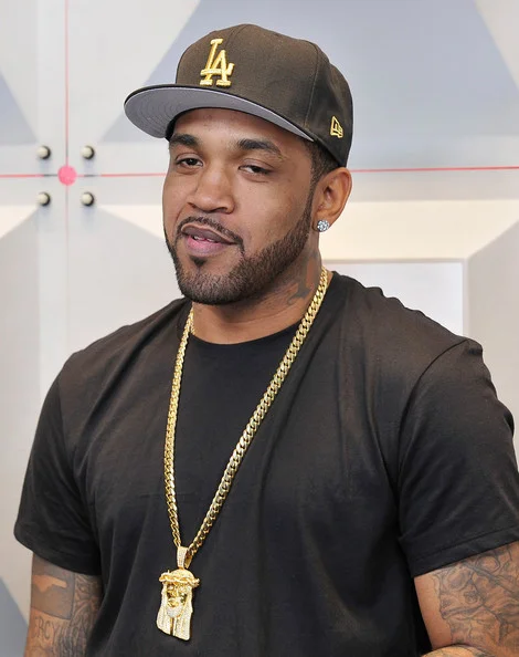 Lloyd Banks looking hot with a gold chain on and he's wearing a black shirt.jpg