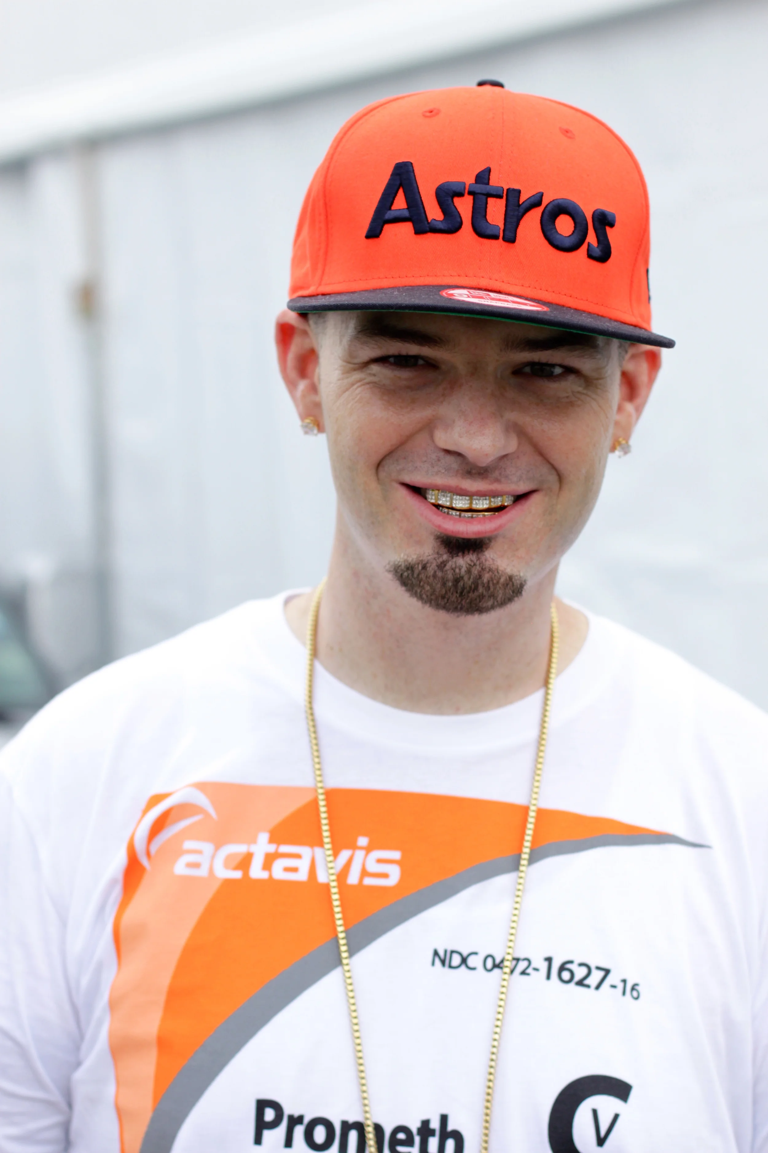 Paul Wall looking hot in an orange Houston Astros hat.jpg